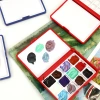 ٢٤ علبة من الطلاء الملونة ذات اللون المغلَّف بـ ١ ملل، علبة حمراء صغيرة فارغة Specification image